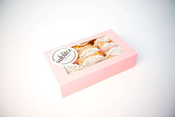 Two dozen White Chocolate Raspberry Subarz beautifully packaged in a gift box, perfect for holiday celebrations and corporate gifting. Each Subarz combines the tartness of raspberry with the sweetness of white chocolate, creating a delightful treat for any occasion